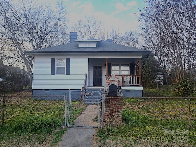 bungalow-style house with crawl space, a fenced front yard, a gate, and a porch