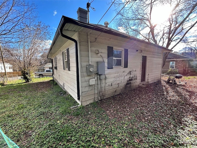 view of home's exterior featuring a chimney