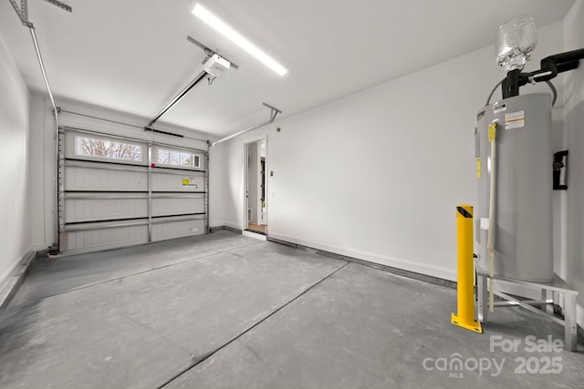 garage with baseboards, a garage door opener, and water heater