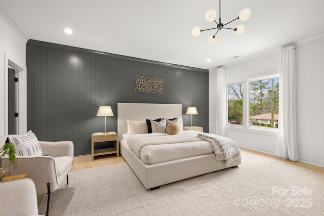 bedroom featuring recessed lighting, baseboards, an inviting chandelier, and light wood-style flooring