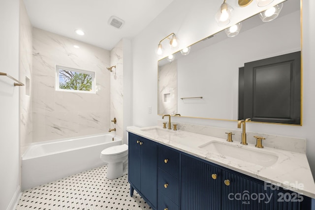 full bath featuring a sink, shower / bath combination, toilet, and double vanity