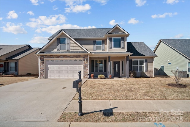 craftsman-style home featuring driveway, stone siding, and a shingled roof