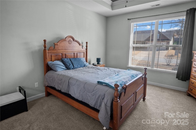 bedroom with light carpet, visible vents, and baseboards