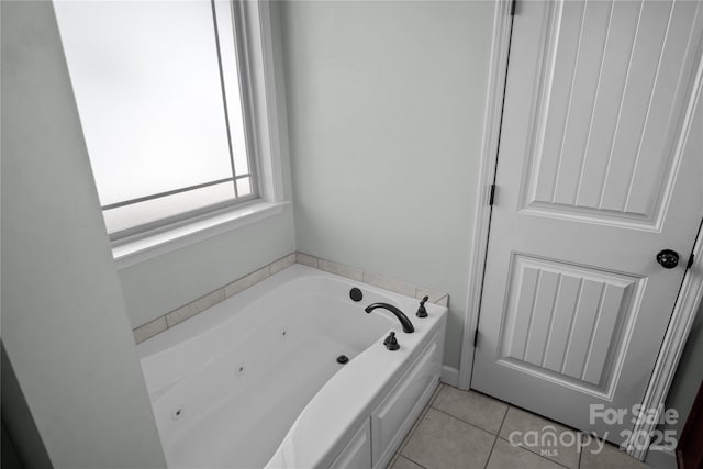 bathroom featuring a whirlpool tub and tile patterned flooring