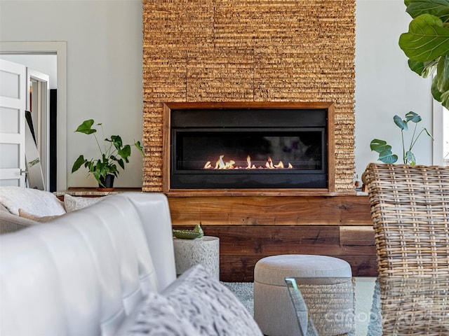 interior space featuring a glass covered fireplace