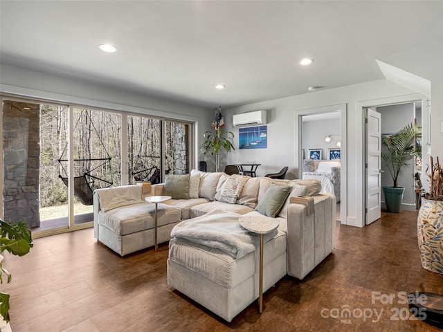 living room with an AC wall unit and recessed lighting