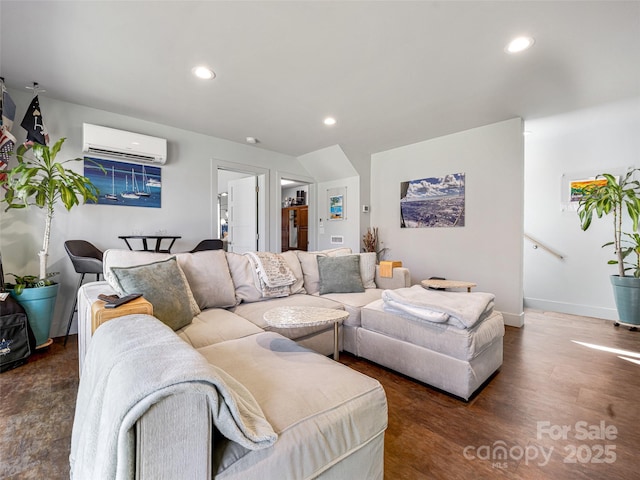 living room with baseboards, a wall unit AC, wood finished floors, and recessed lighting