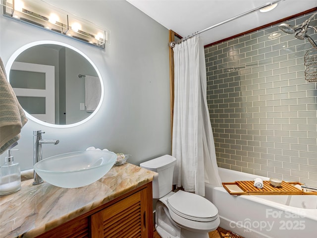 full bathroom with vanity, toilet, and shower / bath combo with shower curtain