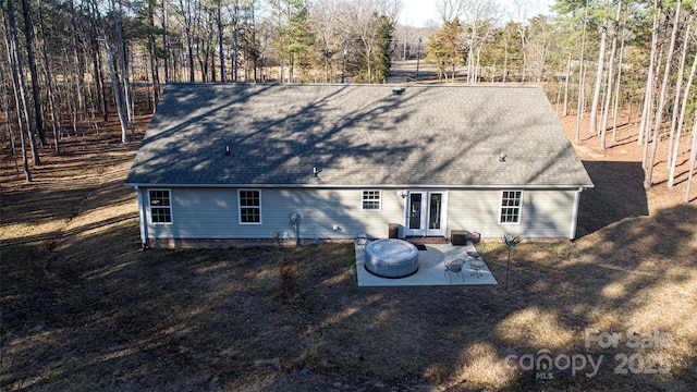 rear view of house with french doors and a patio