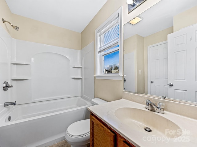 bathroom with toilet, tub / shower combination, and vanity