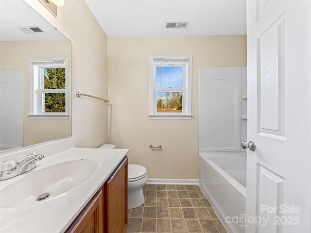 full bathroom with toilet, baseboards, visible vents, and vanity