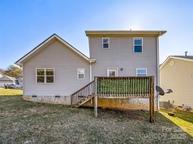 back of house with crawl space, a yard, and central air condition unit