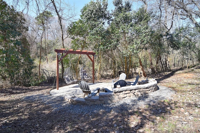 view of yard with a patio area and an outdoor fire pit