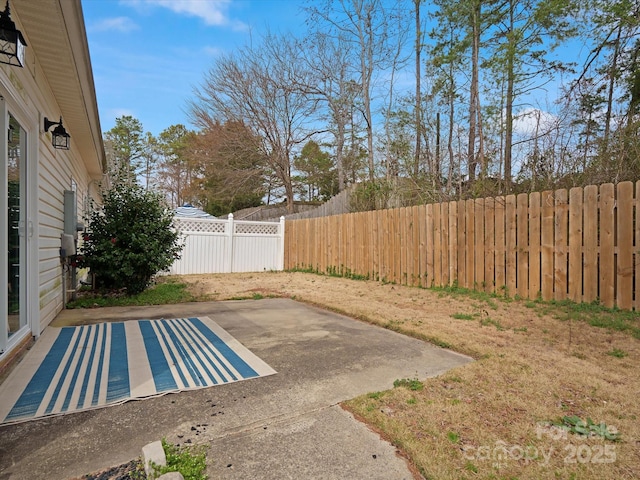 view of yard featuring a patio area and fence