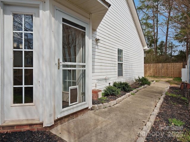 view of home's exterior with fence