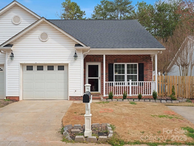 view of front of house with concrete driveway, an attached garage, fence, a porch, and brick siding