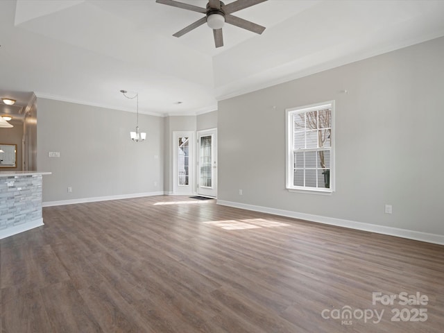 unfurnished living room featuring a healthy amount of sunlight, ceiling fan, and baseboards