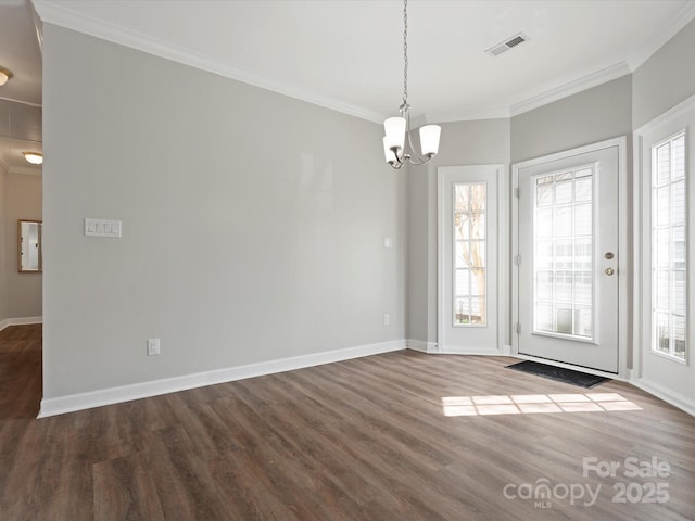 interior space with a healthy amount of sunlight, visible vents, and crown molding