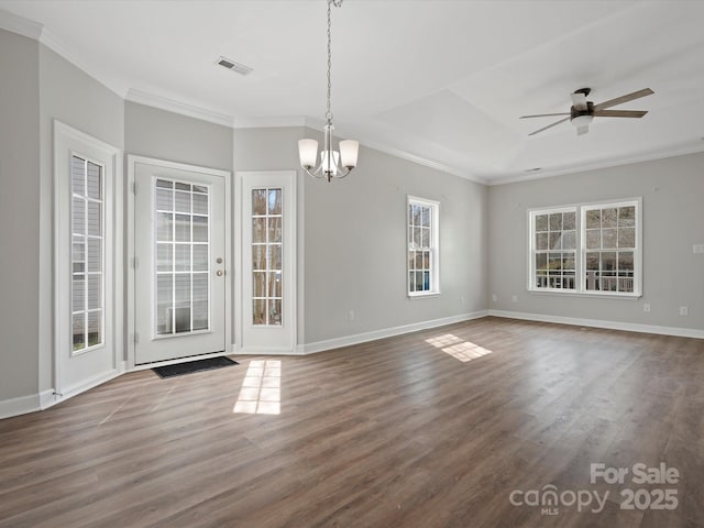 unfurnished room with dark wood-style floors, visible vents, crown molding, and baseboards