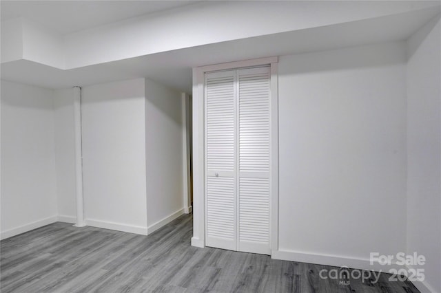 basement with light wood finished floors and baseboards