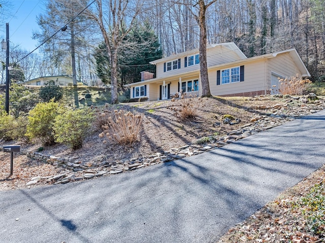 view of front of property featuring a garage and covered porch