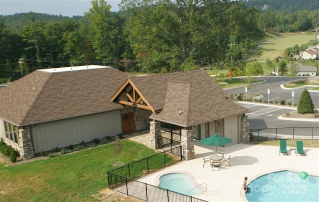 view of pool with fence, a fenced in pool, and a patio