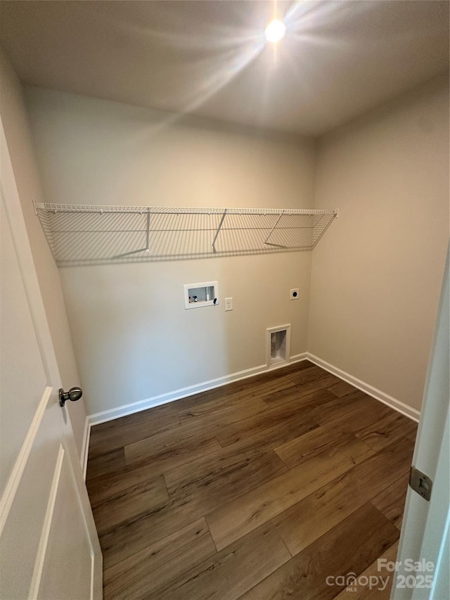 laundry room featuring laundry area, baseboards, dark wood-style flooring, hookup for a washing machine, and hookup for an electric dryer