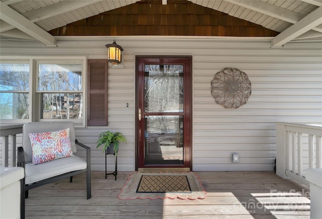 entrance to property featuring a porch