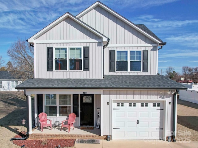 view of front of home featuring roof with shingles, a porch, and board and batten siding