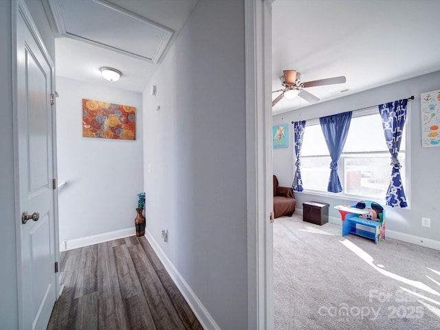 corridor with visible vents and baseboards