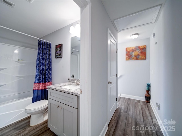 full bath featuring shower / bath combo, visible vents, toilet, wood finished floors, and vanity