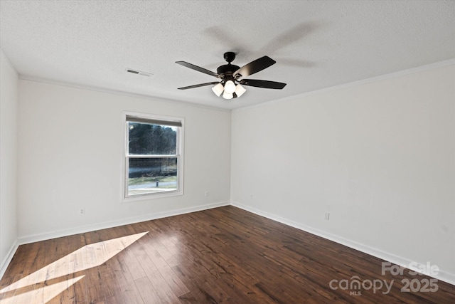 unfurnished room featuring dark wood-style floors, visible vents, a textured ceiling, and baseboards