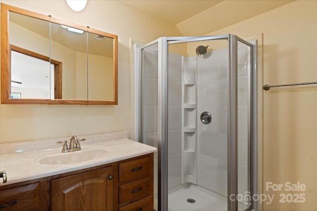 full bath featuring a shower stall and vanity