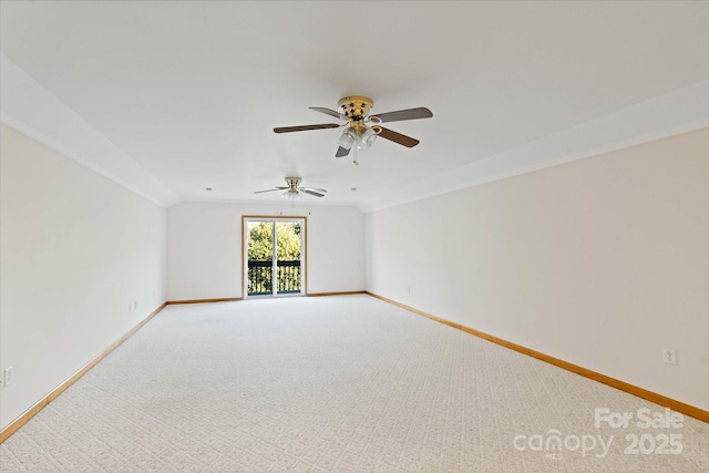 unfurnished room with light carpet, ceiling fan, vaulted ceiling, and baseboards