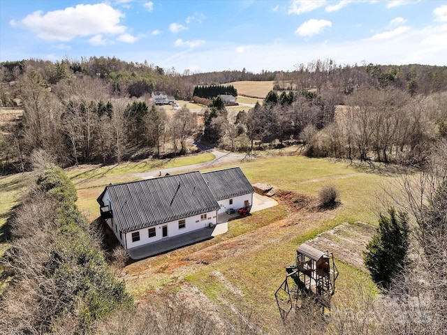 bird's eye view featuring a rural view and a forest view