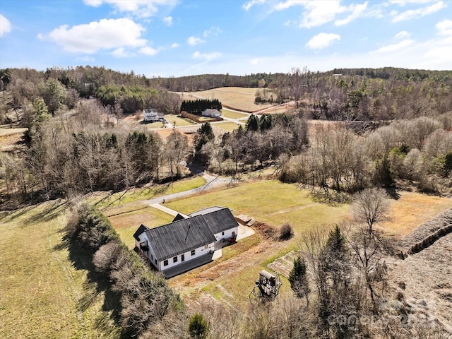 drone / aerial view with a rural view and a view of trees