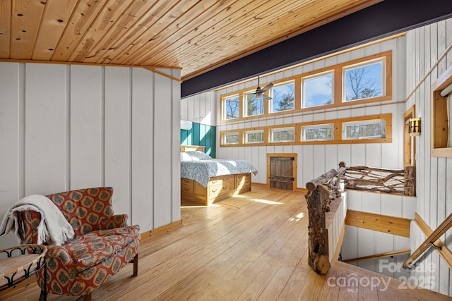 bedroom featuring light wood-type flooring and wooden ceiling