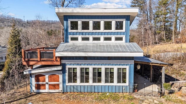 back of property with board and batten siding