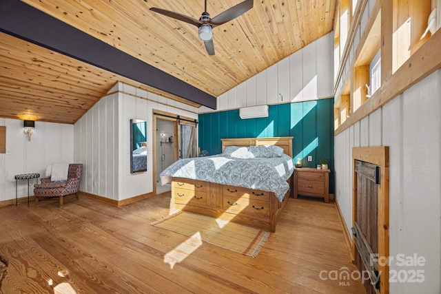 bedroom featuring vaulted ceiling with beams, a wall mounted air conditioner, wood ceiling, and light wood-style floors