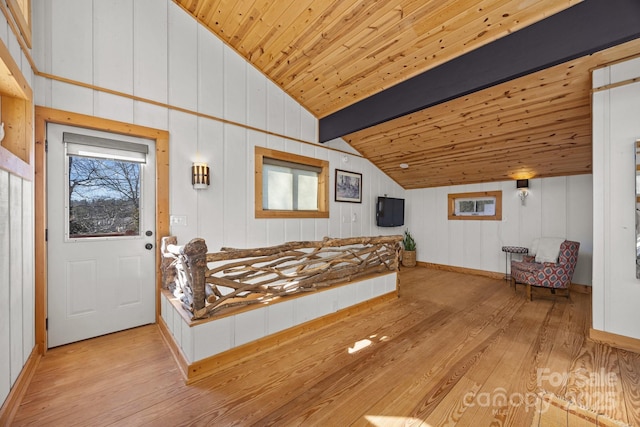 bedroom featuring vaulted ceiling with beams, multiple windows, light wood-type flooring, and wooden ceiling