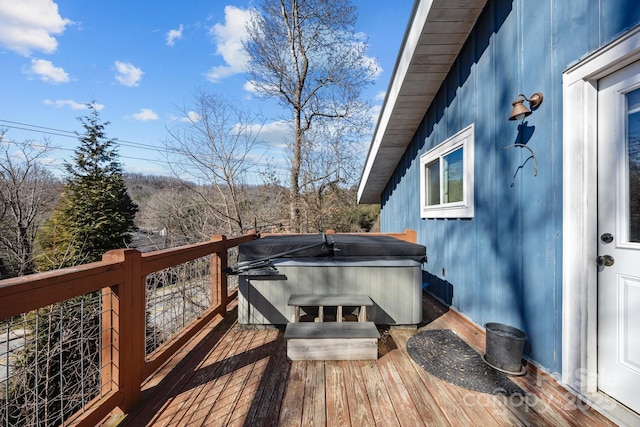 wooden terrace with a hot tub