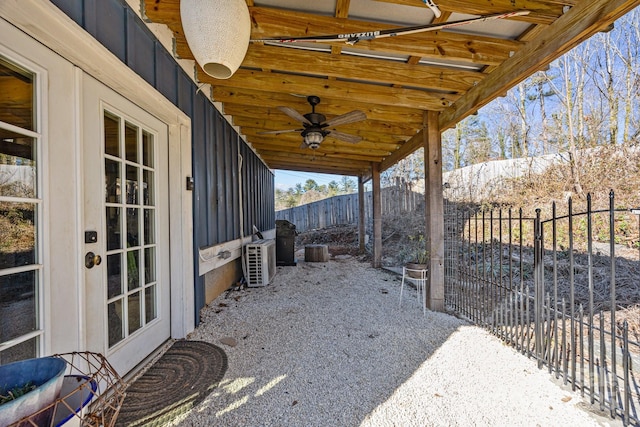 view of patio with a fenced backyard and a ceiling fan