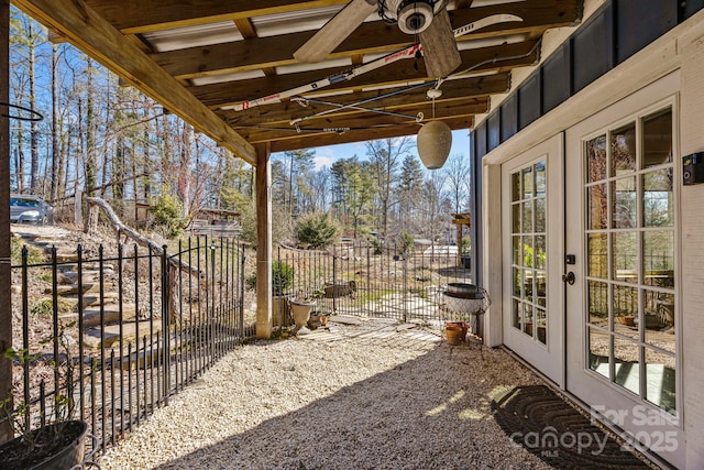 exterior space featuring french doors and fence