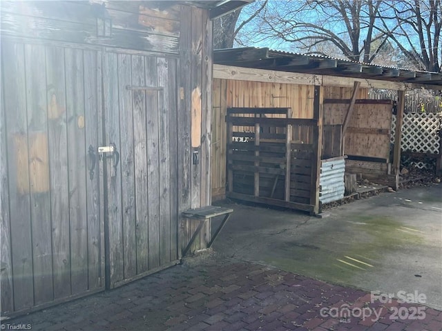 view of gate with an outdoor structure