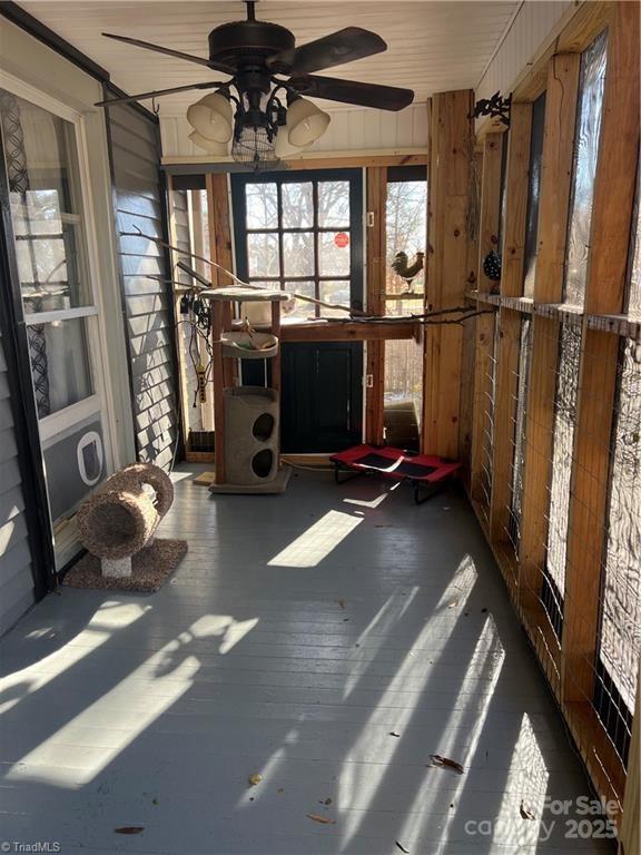 sunroom / solarium with ceiling fan