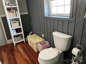 bathroom featuring toilet and wood finished floors