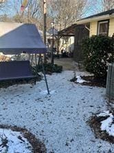 snowy yard with a trampoline