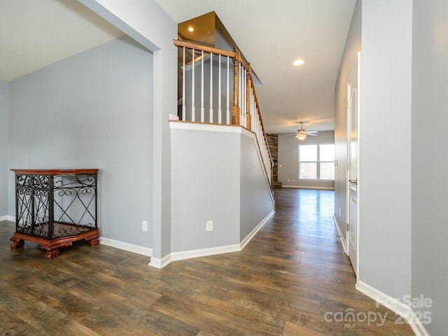 hall with recessed lighting, stairway, baseboards, and wood finished floors