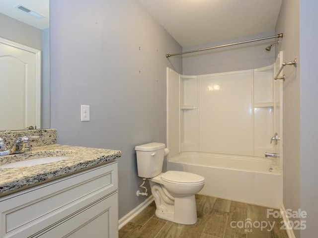 full bathroom featuring vanity, wood finished floors, visible vents, tub / shower combination, and toilet