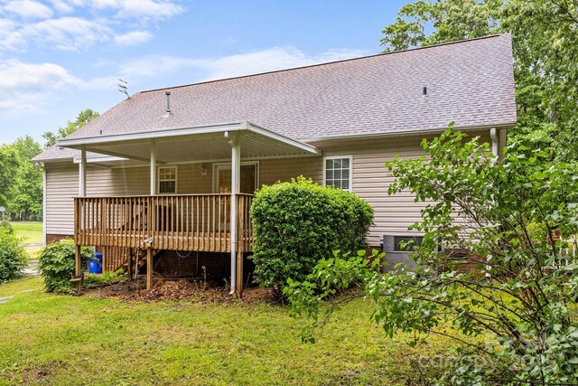 3039 Paraham Rd S, York, SC 29745 - rear view of property featuring a shingled roof, a lawn, and a wooden deck